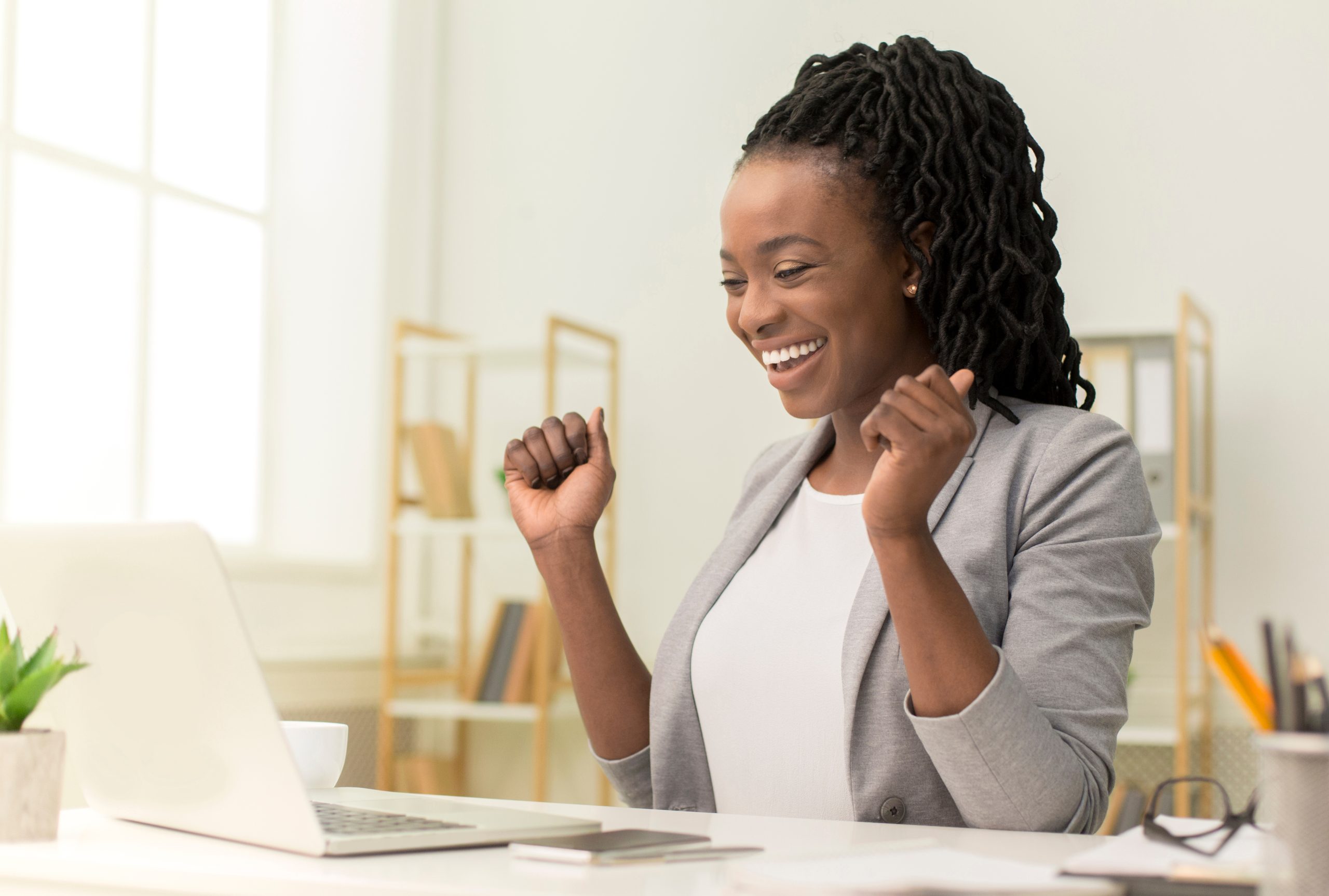 Business,Success.,Excited,Black,Businesswoman,Sitting,At,Laptop,Shaking,Fists
