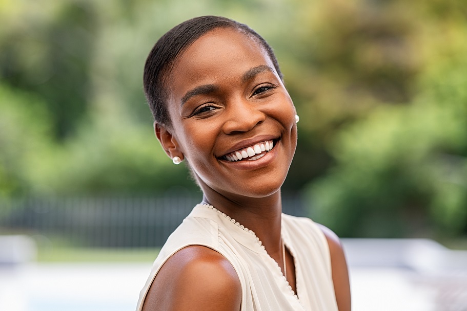 Portrait,Of,Smiling,Middle,Aged,African,Woman,Looking,At,Camera.